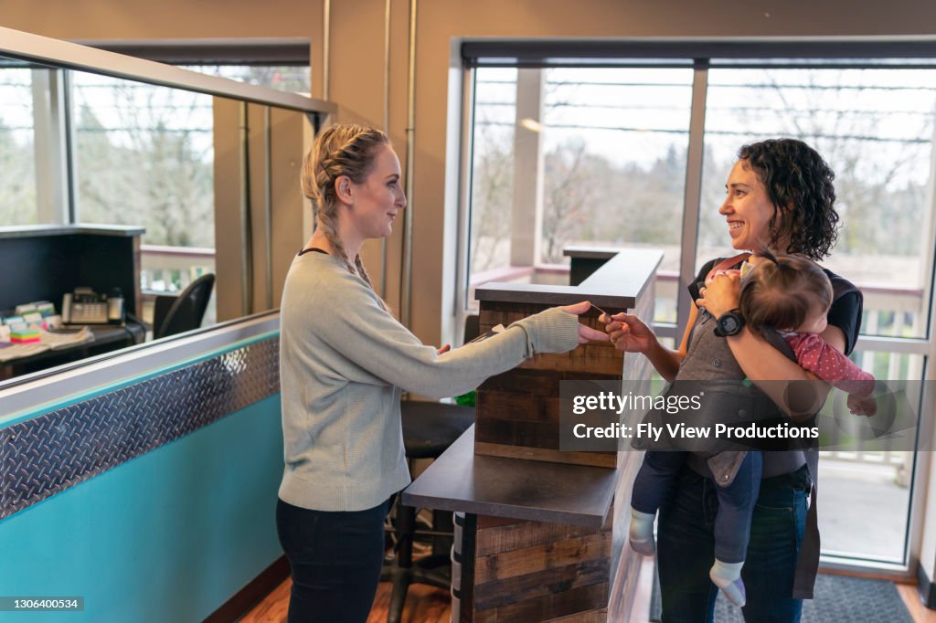 Small Transaction Small Business Owner Processing Transaction For Customer High-Res Stock ...
