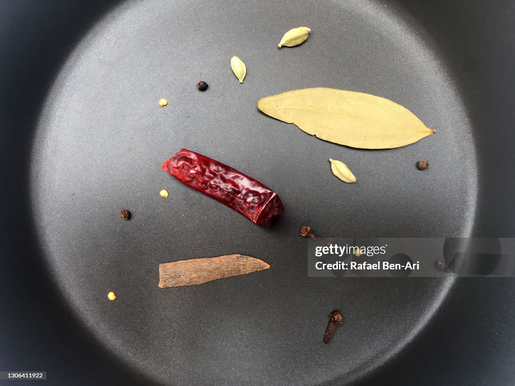 Indian food spice mix fry in a frying pan