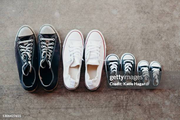 family's shoes lined up together - converse sneaker fotografías e imágenes de stock