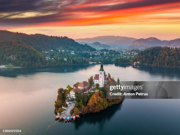 bled lake at sunset aerial view, bled, slovenia - bled slovenia stock-fotos und bilder
