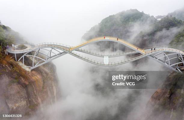 Cloud-shrouded Ruyi Bridge is seen at Shenxianju Scenic Area on March 9, 2021 in Taizhou, Zhejiang Province of China.