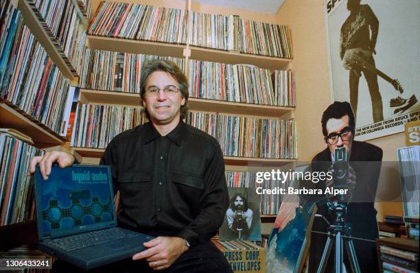 Dick Wingate, sitting in front of his record collection, is Senior Vice President of Content Development at Liquid Audio, a new streaming service...