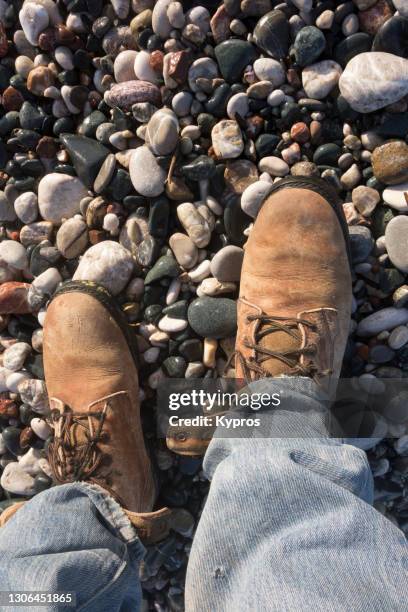 man wearing leather boots - work boot stock pictures, royalty-free photos & images