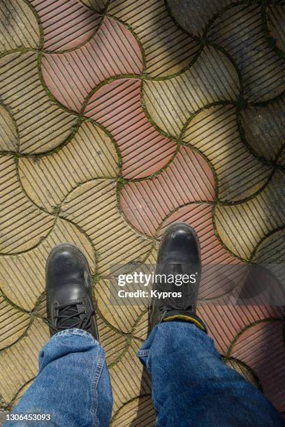 man wearing leather boots - work boot stock pictures, royalty-free photos & images