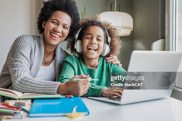 portrait of a mother and her daughter learning at home - teacher school supplies stock pictures, royalty-free photos & images