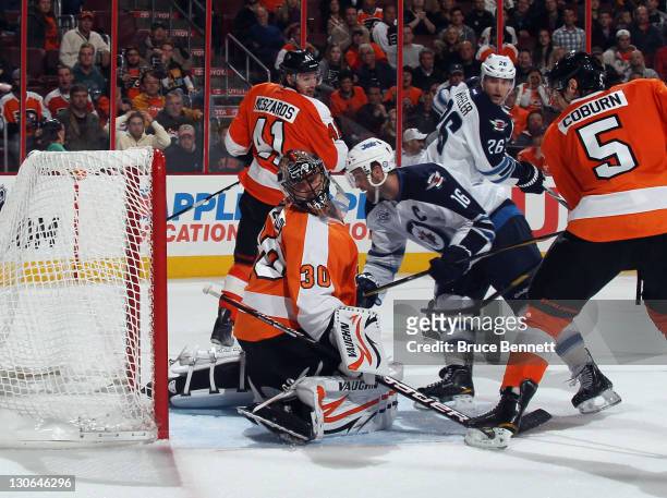 Andrew Ladd of the Winnipeg Jets scores the game winning goal against Ilya Bryzgalov of the Philadelphia Flyers at 18:54 of the third period at the...