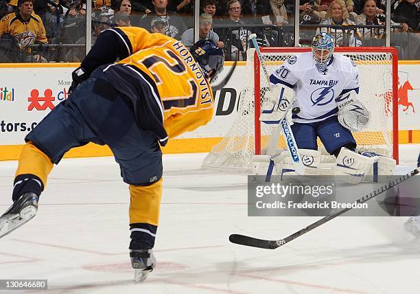 Patric Hornqvist of the Nashville Predators takes a shot on goalie Dwayne Roloson of the Tampa Bay Lightning at Bridgestone Arena on October 27, 2011...