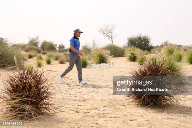 Eddie Pepperell of England walks through the scrub on the 10th hole during Day One of the Commercial Bank Qatar Masters at Education City Golf Club...