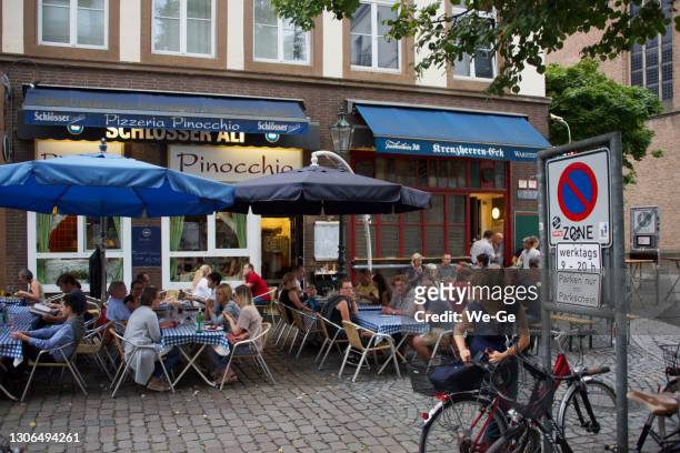 exterior view of a typical altbier pub on ratinger straße in duesseldorf's old town. - altbier stock pictures, royalty-free photos & images