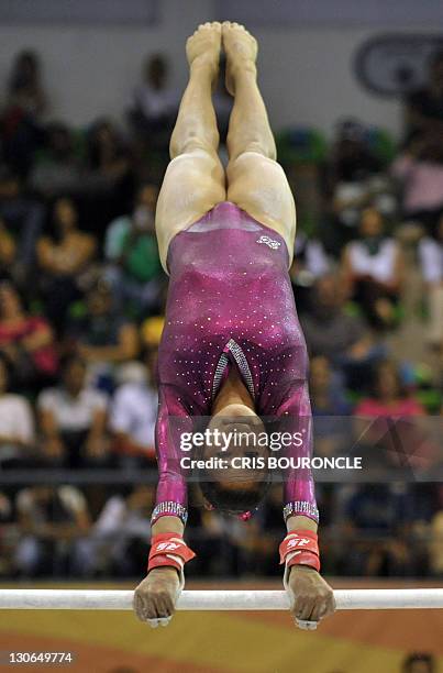 Mexican gymnast Marisela Cantu performs her parallel bars routine to win the bronze medal, tied to fellow country woman Elsa Garcia, in the...