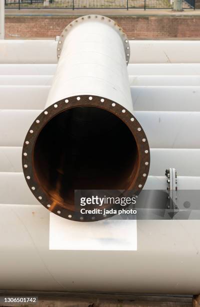 white steel pipe tube with drilled flanges on both sides - open round one stock pictures, royalty-free photos & images