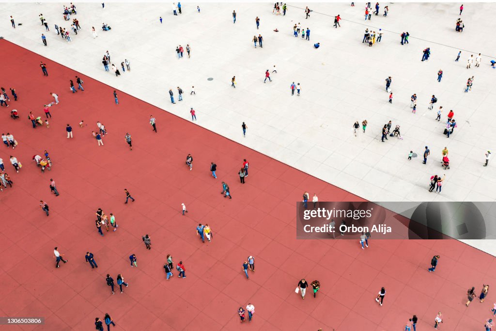 Crowds standing on two separated zones