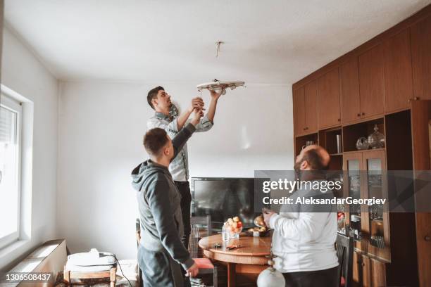 let's fix the ceiling light - installing tv stock pictures, royalty-free photos & images