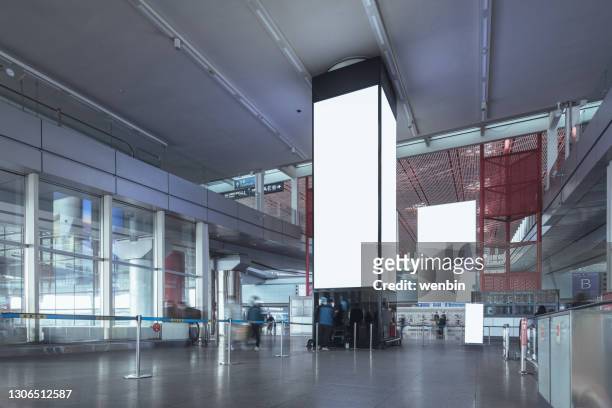 blank billboard on the corridor of airport - shopping centre ad stock pictures, royalty-free photos & images