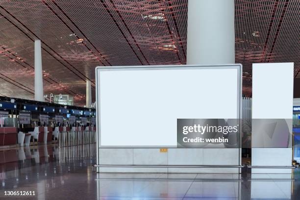 blank billboard on the corridor of airport - shopping centre screen stock pictures, royalty-free photos & images