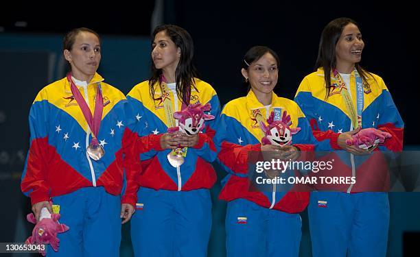 Mariana Gonzalez, Yulitza Suarez, Marina Gonzalez and Maria Martinez of Venezuela after receiving their bronze medal in women's foil team at the...