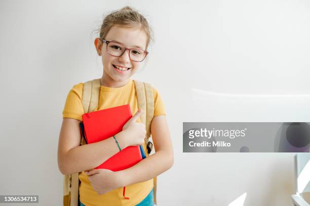 portrait of a school girl in front of the white wall - 8 stock pictures, royalty-free photos & images