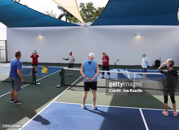 Bob Savar teaches a class in the game pickleball to a group fully vaccinated against COVID-19 at the John Knox Village Continuing Care Retirement...