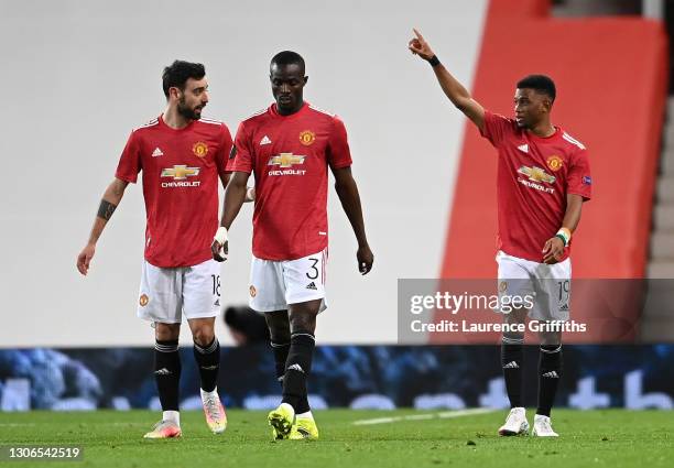 Amad Diallo of Manchester United celebrates with teammates Bruno Fernandes and Eric Bailly after scoring their team's first goal during the UEFA...