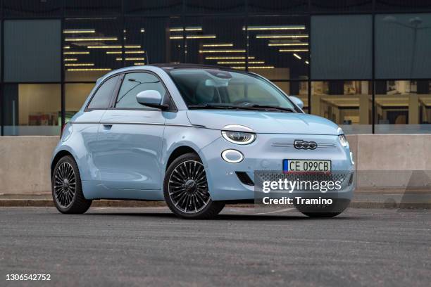 electric car fiat 500e on a street - fiat stock pictures, royalty-free photos & images