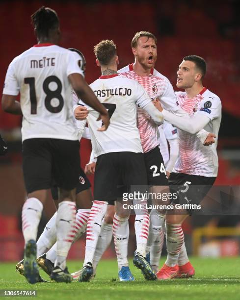 Simon Kjaer of A.C. Milan celebrates with teammates Samu Castillejo and Diogo Dalot after scoring their team's first goal during the UEFA Europa...