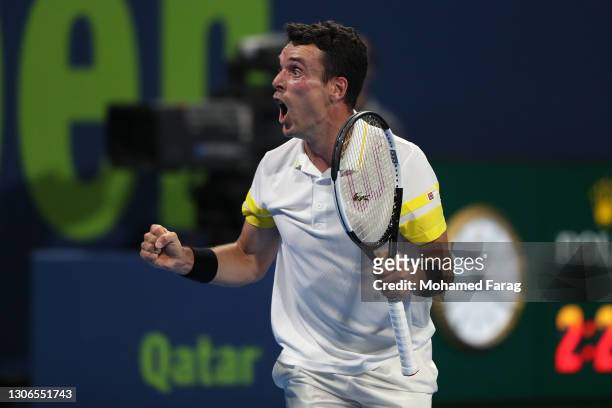Roberto Bautista Agut of Spain celebrates victory in his quarter final match with Dominic Thiem of Austria in the Qatar ExxonMobil Open at Khalifa...