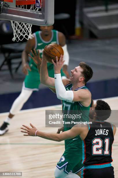 Luka Doncic of the Dallas Mavericks drives to the basket against Tyus Jones of the Memphis Grizzlies in the second half at American Airlines Center...
