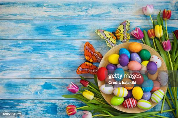 easter background with colorful eggs and tulips - holy week banner stock pictures, royalty-free photos & images