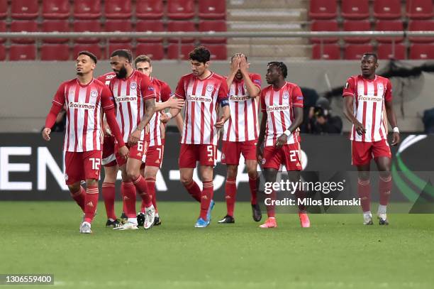 Youssef El-Arabi of Olympiacos FC celebrates with teammates after scoring their team's first goal during the UEFA Europa League Round of 16 First Leg...