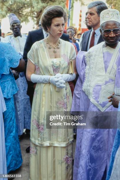 British Royal Princess Anne, Princess Royal wearing a sleeveless floral print outfit, with the President of Gambia Sir Dawda Jawara attending the...