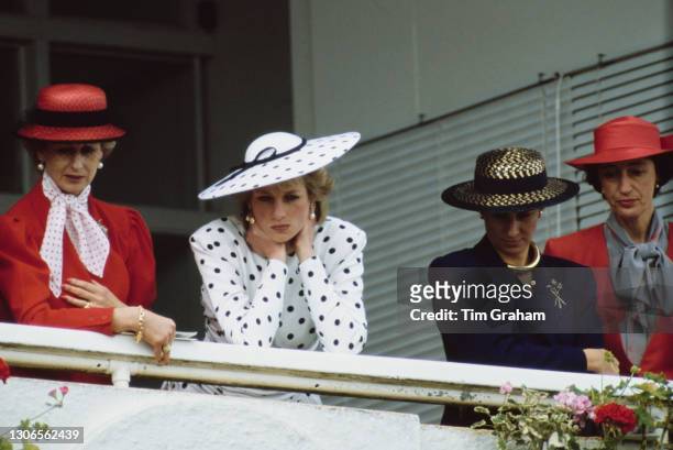 British Royals Princess Alexandra, Diana, Princess of Wales , wearing a dress by Victor Edelstein and hat by Frederick Fox, an unspecified woman, and...
