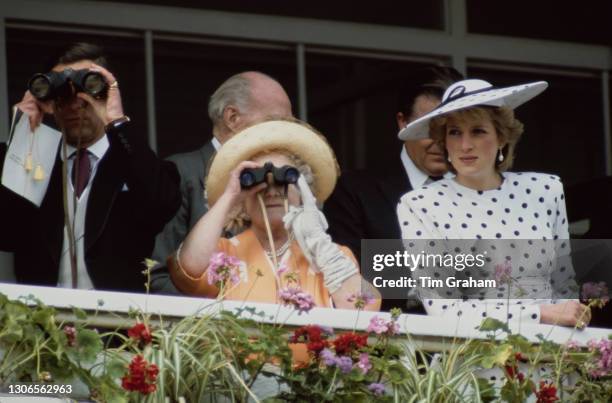 British Royals Charles, Prince of Wales, Queen Elizabeth The Queen Mother , and Diana, Princess of Wales , wearing a dress by Victor Edelstein and...