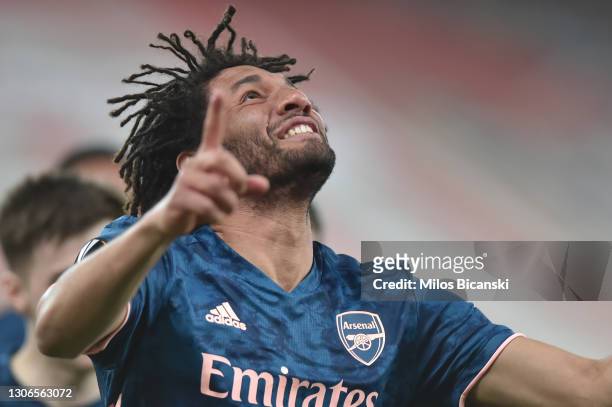 Mohamed Elneny of Arsenal celebrates after scoring their side's third goal during the UEFA Europa League Round of 16 First Leg match between...
