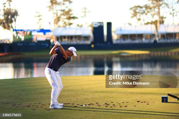 Collin Morikawa of the United States plays his shot from the 17th tee during the first round of THE PLAYERS Championship on THE PLAYERS Stadium...