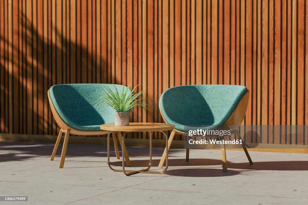Three dimensional render of two retro styled chairs, coffee table and potted plant standing on balcony