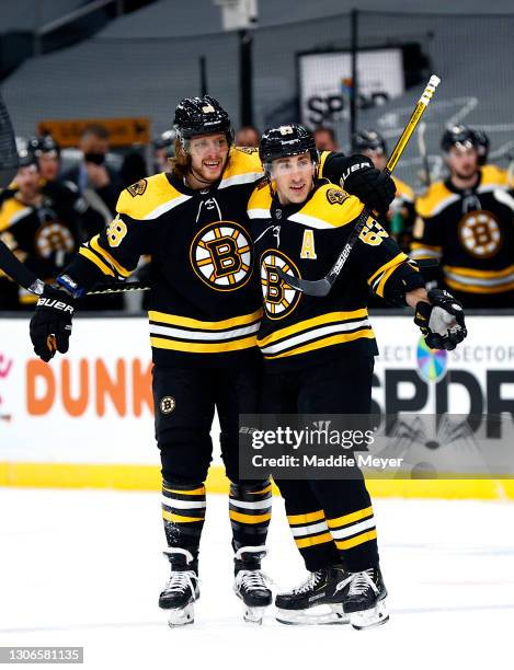 David Pastrnak of the Boston Bruins celebrates with Brad Marchand after scoring a goal against the New York Rangers during the first period at TD...