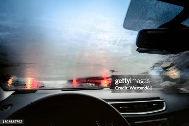 car interior view withfoggy windshield - フロントガラス ストックフォトと画像