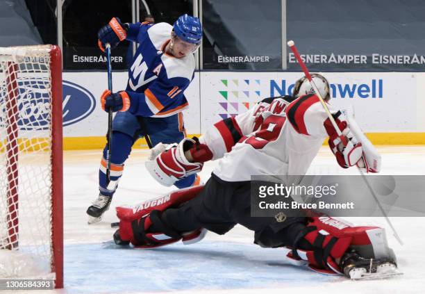Mackenzie Blackwood of the New Jersey Devils makes the second period save on Anthony Beauvillier of the New York Islanders at the Nassau Coliseum on...