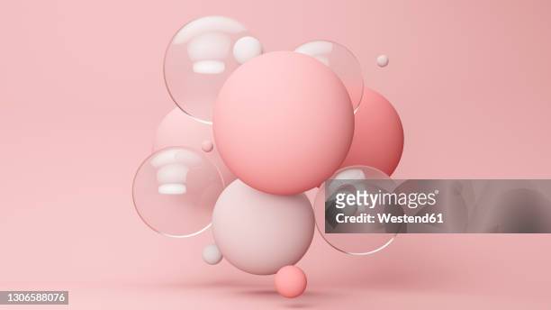 three dimensional render of pastel colored bubbles floating against pink background - magenta stock illustrations