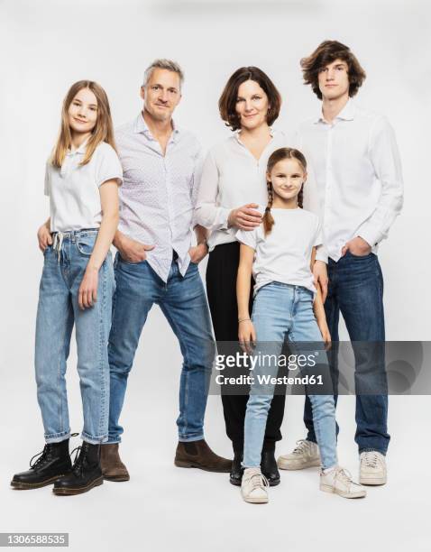 happy family with children standing against white background - fünf personen stock-fotos und bilder