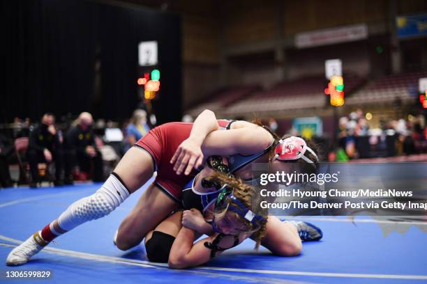 Savannah Cosme of Chatfield, top, controls Sarah Savidge of Doherty during 127 pound Girls State Championship match at Southwest Motors Events Center...
