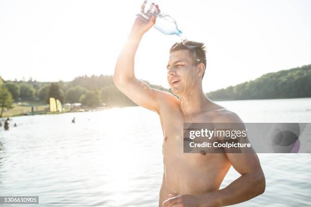 young man exercising. - man mid 20s warm stock pictures, royalty-free photos & images