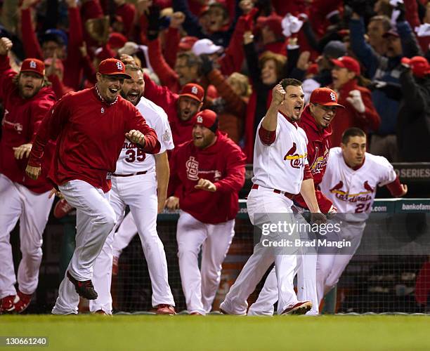 The St. Louis Cardinals react after David Freese hits an 11th inning walk-off home run to win Game Six of the 2011 World Series against the Texas...