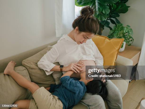 asian sibling with woman pregnant - baby number 2 stock pictures, royalty-free photos & images