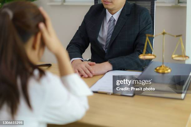 lawyer having meeting and consoling solution to his clients provide legal advice and trust commitment strain serious for problem, justice and attorney concept - bâtiment public photos et images de collection