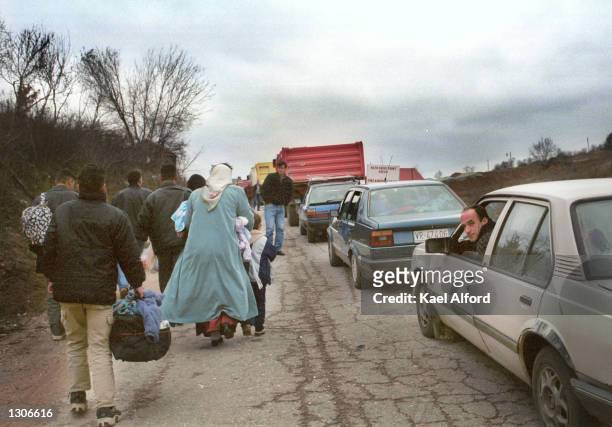 Albanian refugees from the Presevo valley in southern Serbia arrive at the American KFOR controlled sector of Kosovo at the Mucibaba border crossing...