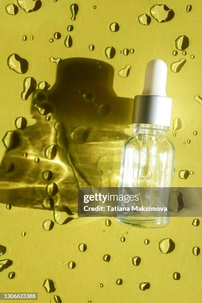 top view of face serum bottle - bottles glass top stock pictures, royalty-free photos & images