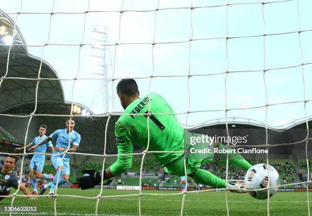 Macarthur FC goalkeeper Adam Federici is beaten by a shot from Jamie Maclaren of Melbourne City during the A-League match between Melbourne City and...