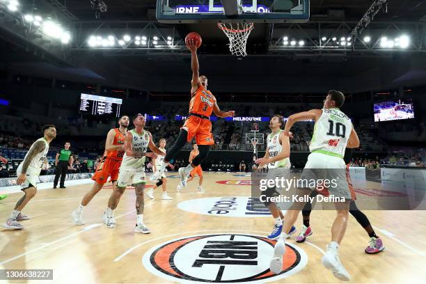Scott Machado of the Taipans drives to the basket during the NBL Cup match between the Cairns Taipans and the South East Melbourne Phoenix at John...
