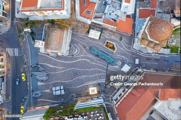 top down aerial photo of monastiraki square in the old town of athens, greece - plaka greek cafe stock pictures, royalty-free photos & images